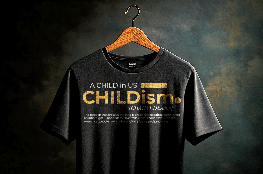 CHILDISM t-shirt — the CHILD wordmark in yellow with a boy looking upward through the letters.